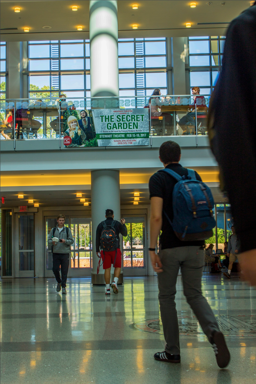 A banner printed at Wolf Xpress is on display in Talley Student Union.