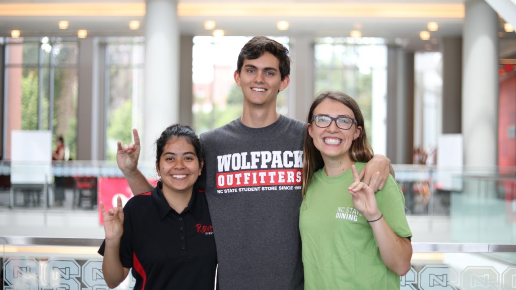 Three student employees from Dining, Wolfpack Outfitters and Rave! Events