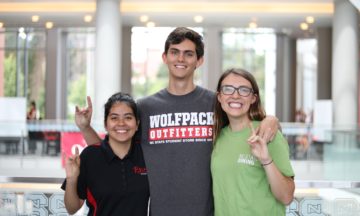 Three student employees from Dining, Wolfpack Outfitters and Rave! Events