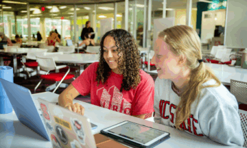 students studying using electronic course materials