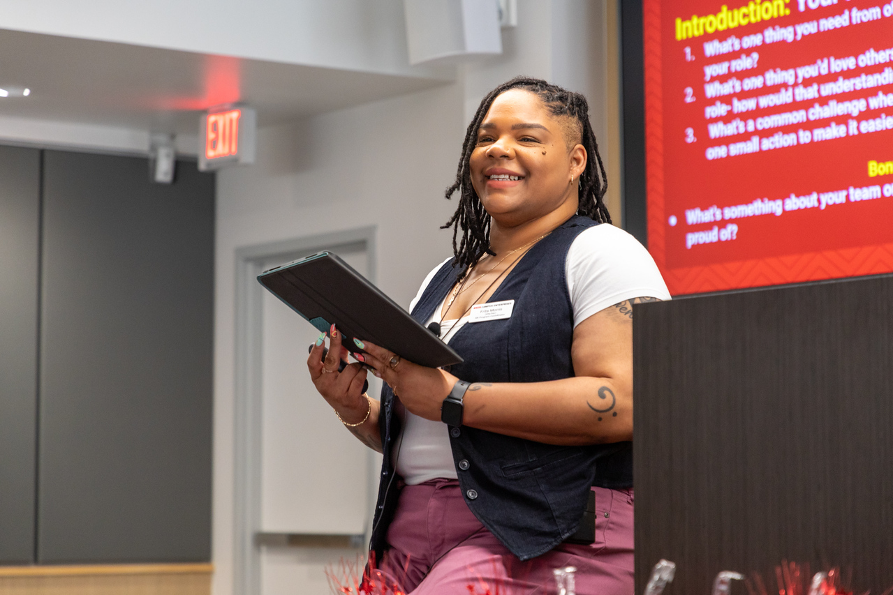 Staff member leads an HR training session. 