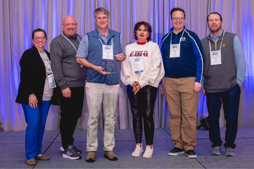 Nathanael Barnes and Anthony Sanders (second and third from left) accept ICBA award.